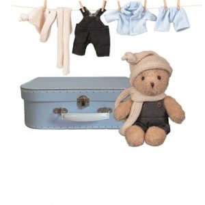 MORRIS ET SES HABITS DANS UNE VALISE